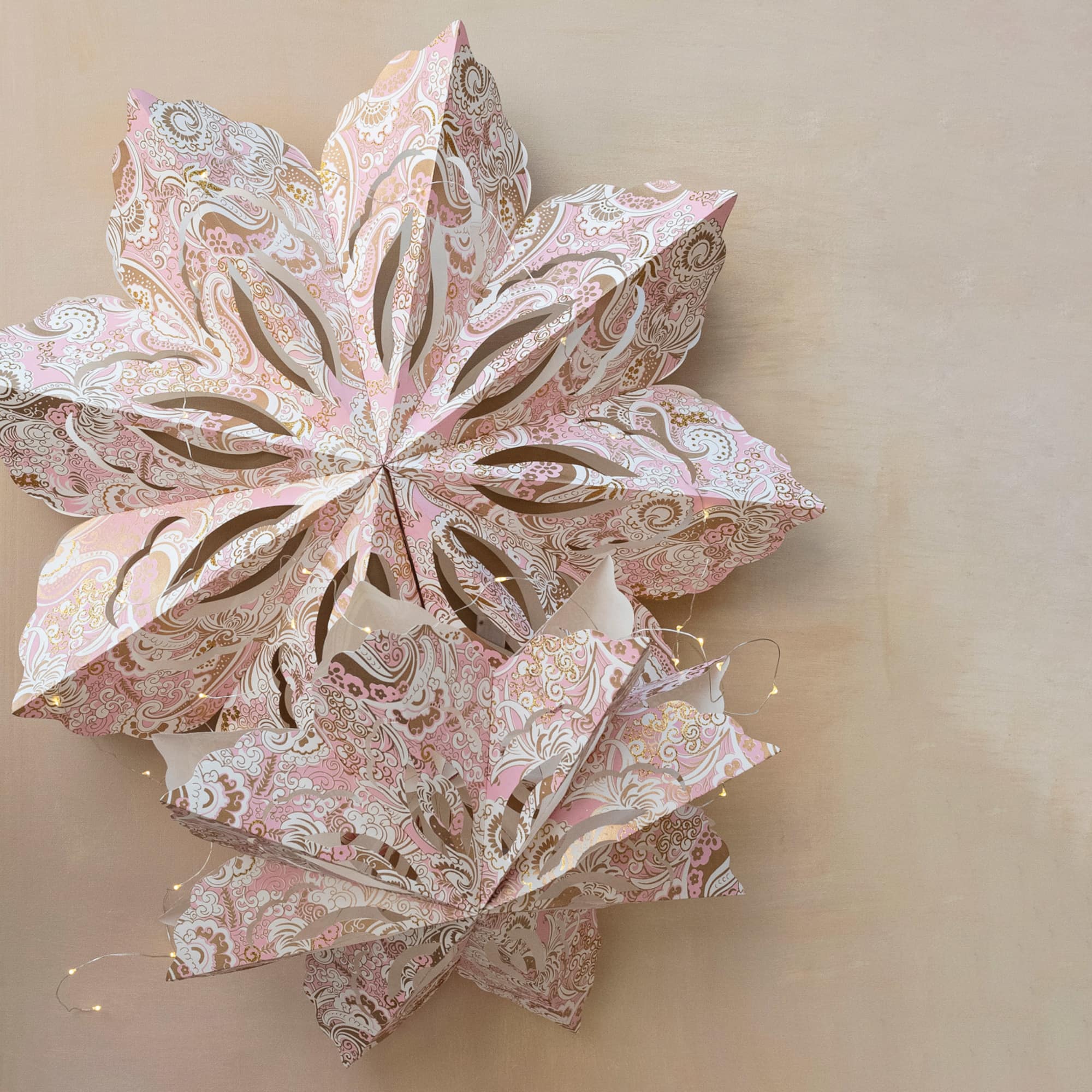 Hello Honey® 25" LED Pink, White & Gold Printed Paper Folding Snowflake Ornament with Paisley Pattern